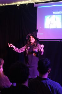 Dr Encarna Micó Amigo presenting with a magician theme